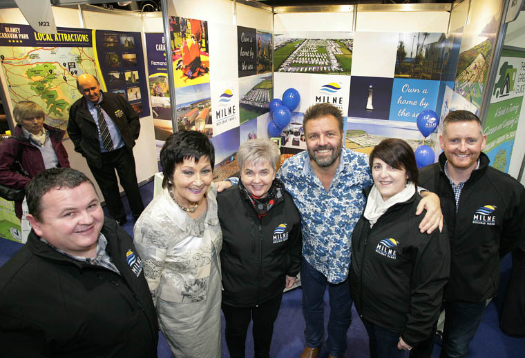 Pictured at the 25th Holiday World Show in Titanic Exhibition Centre, Belfast, on the Milne Holiday Parks stand (Kilkeel), are (l-r) Richard Griffin; show organiser Maureen Ledwith; Wendy Boyd; TV celebrity Martin Roberts; Catherine Griffin and Aaron Hazley.