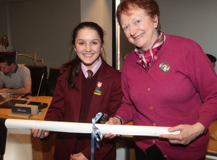 Molly McCartan from St Mary’s High School receives a copy of the UN charter from UNA NI representative Carol Conlin.