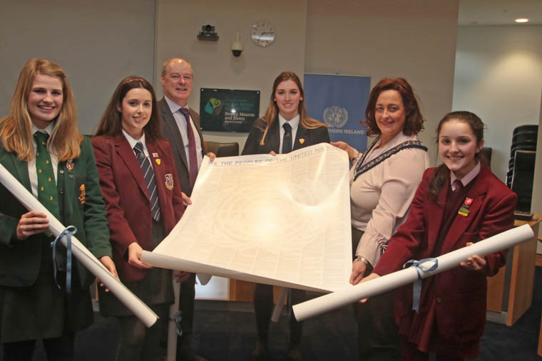 Pictured with a copy of the original UN charter presented to the local schools were Liam Hannaway, Chief Executive of Newry, Mourne and Down District Council, Councillor Gillian Fitzpatrick, Council Chairperson, with (from left) Louis Tate (Down High School); Kerrie Fegan, (St Paul’s High School); Sarah McGlynn (Shimna Intergated College); and Molly McCartan (St Mary’s High School).