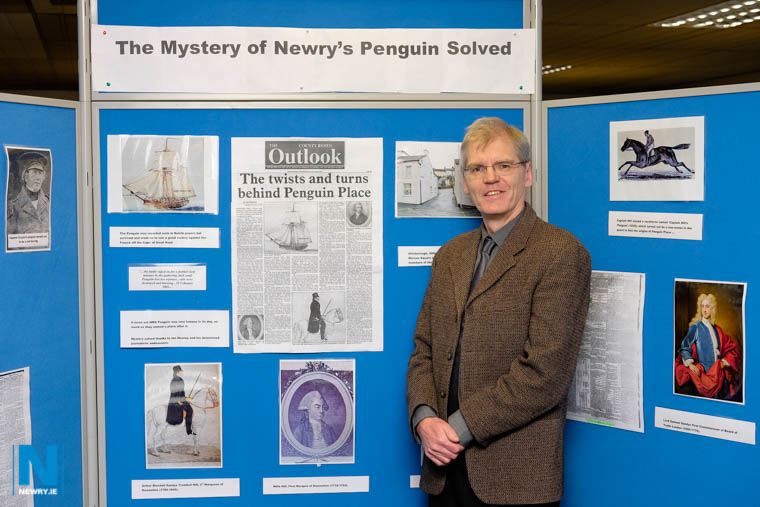 Journalist Ian Heaney with his exhibition in Newry Library. Photograph: Columba O'Hare