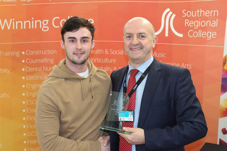 Aodhan O’Brien from Newry accepting the STEM Overall Winner award from Raymond Sloan Director of Client Services at SRC.