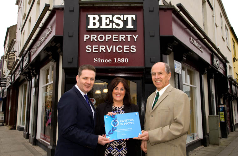 Best Property Services Office manager Edwina Flynn, with Eddie Salmon, Investors in People Practitioner Manager for IIP and Managing Director Garry Best with their new IIP plaque.