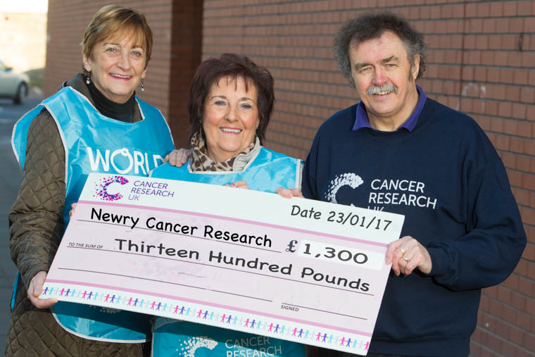 Lorraine McKeown and Gertrude Galloghly presents a cheque for £1300 to Newry Cancer Research, Treasurer, Paddy O’Hanlon.