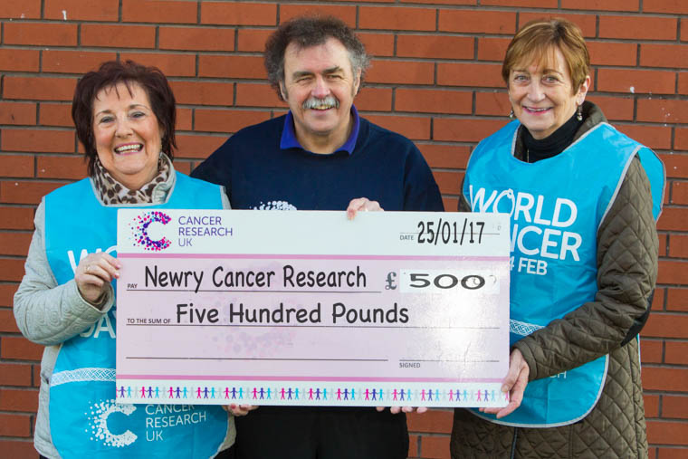 Lorraine McKeown and Gertrude Galloghly presents a cheque for £500 to Newry Cancer Research, Treasurer, Paddy O’Hanlon.