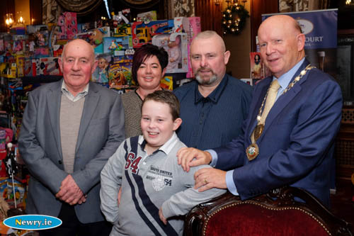 Michael McKeown, President, Newry Chamber of Commerce pictured with Daniel Boyle, one of the Chamber's 'Dream Children' at last weeks Chamber Dinner. Also included is Daniel's Grandad Michael, Aunt Elaine and Dad Michael. Photograph: Columba O'Hare