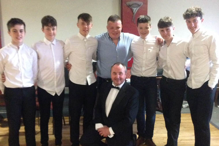 Pictured with Fashion Show MC Pat McGinn are Under 16 hurlers and the 