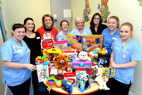 Staff from the Children’s Ward at Daisy Hill Hospital and Chair of the Southern Health and Social Care Trust, Roberta Brownlee with the generous toy donation from the Friends of Daisy Hill Hospital.