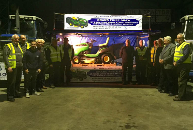 Bessbrook District Vintage Tractor Club with the Lawn Mower they are raffling for the Hospice.