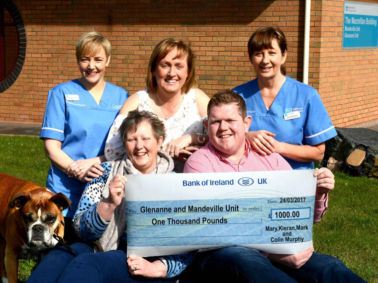 Making the presentation to the Mandeville and Glenanne units are Back: Staff Nurse Maureen Devlin, Julia Murnin and Breast Care Nurse Specialist Eimer McGeown Front Row: Rocky, Mary Murphy and Mark Murphy