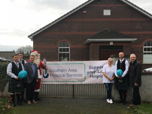 Members of Markethill Pipe Band with Andrea Pearson Southern Area Hospice, Councillor David Taylor and Danny Kennedy MLA