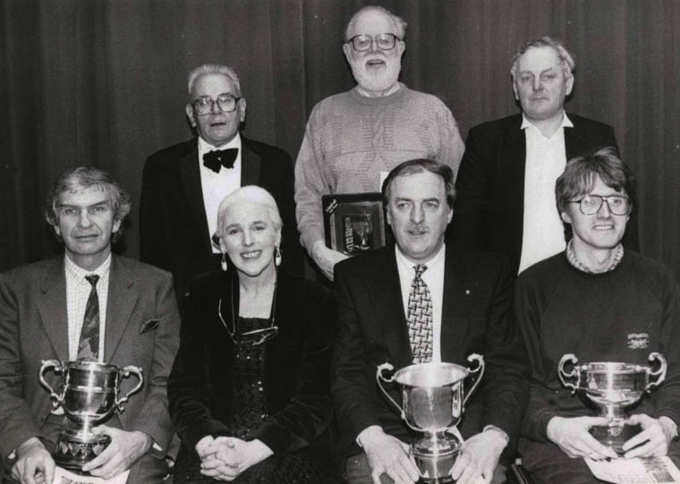Roma Tomelty, adjudicator, pictured with prize winners at Newry Drama Festival, 1993. Roma (first Director of Newry and Mourne Arts Centre) has also acted as adjudicator at Lislea Drama Festival, to which in 1983 she presented the “Min Milligan Trophy” in memory of her grandmother. Min Milligan was a talented actress of radio and stage fame, who was a household name in the 1940s and 1950s for her portrayal of ‘Sarah’ in the radio soap opera, The McCooeys.