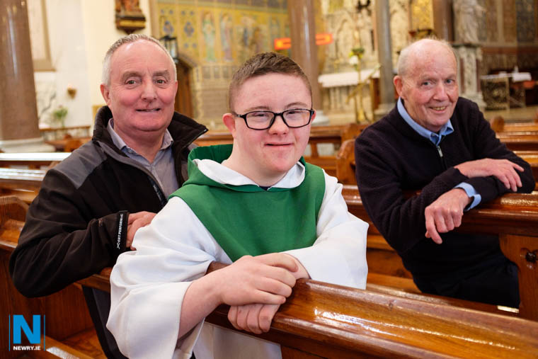 Sean McMillan with his dad John and Fr Vincent Travers, St Catherine's Dominican, Newry. Photograph: Columba O'Hare