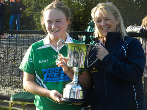 Louise Kenny, Shane O’Neill’s captain, accepts the Ulster Intermediate trophy