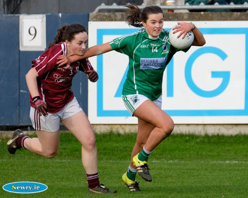 Shane O'Neill's Aimee Mackin brushes of Annaghdown's Bronagh Quinn at the All Ireland Intermediate Club Football Final in Parnell Park. Photograph: Columba O'Hare