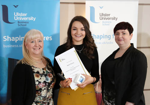 Niamh Downey is presented with the CIM Award for Excellence by sponsor representative Kathryn Pyper (right) watched by Course Director Dr Mary Boyd (left). Photograph: Darren Kidd / Press Eye