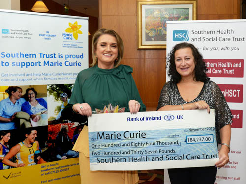 Roberta Brownlee Southern Trust Chair (left) presents Jude Bridge, Marie Curie Executive Director with the cheque.