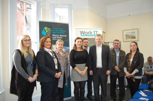 Celebrating the Work It Programme are Carla Campbell - Network Personnel - Programme Manager; Newry, Mourne and Down Council, Chairperson Gillian Fitzpatrick; Hilary Singleton, Chairperson for the SIF Southern Zone Steering Group; Junior Minister Megan Fearon; Steven Lavery - Bushcraft Centre manager; Junior Minister Alastair Ross; Seamus McCabe - PIPS Newry and Joanne Shortal - Drumbeg Residents Association 