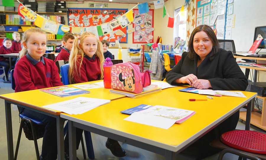  Communities Minister Deirdre Hargey is pictured with pupils from Scoil an Droichid on a visit to open the 2022 Líofa Gaeltacht Bursary Scheme.