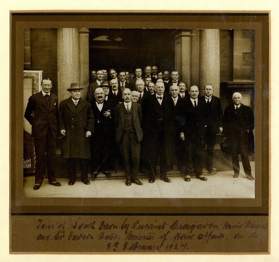 Photograph taken outside Newry Town Hall on 8th February 1927, marking the visit of James Craig, Prime Minister of Northern Ireland, to meet with members of Newry Urban District Council and other local public bodies. James Craig, Viscount Craigavon, can be seen in the front row, third from right with Sir Dawson Bates, Minister of Home Affairs on his right and William Robinson, Chairman of the Council on his left. Newry and Mourne Museum Collection