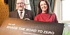Minister Liz Kimmins with Davy Jackson from Road Safe NI as he signs up to Share the Road to Zero community engagement campaign to encourage us to take more responsibility and care on the roads.