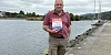 Cllr Aidan Mathers with a book on the  Catalpa Escape 