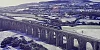 A graphical depiction of the new service crossing over the 18 arches. Image: Iarnrod Eireann/ Translink video still