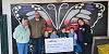 Lisa Cunningham, Asda Kilkeel Community Champion, presents a cheque for £1,000 from the Asda Foundation to Newry Street Unite's Ann Fitzpatrick, left, and Andrew Clements