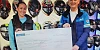 Adrian Fegan Crossan Motorcycles presenting the cheque to Alison Donaghy from Evora Hospice.