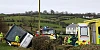 The school bus sits on its side at the scene on the Tullyah road. Photograph: Noel Moan/ Newry Democrat