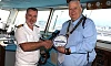 Seadream II Captain Michael Macleoud and Newry Mourne & Down District Council Chairperson Glyn Hanna exchange plaques.
