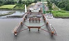A key milestone has been reached in the construction of the €102 million Narrow Water Bridge, with temporary structures designed by Belfast’s AM Consulting Engineers (AMCE) now extending into the River Newry from both banks. For the first time, passersby can now get a sense of how the long-awaited bridge will eventually span the river, as two new 65m structures extend from each bank into the River Newry. Led by the main contractor BAM Ireland, the work marks a significant engineering achievement on the transformative cross-border infrastructure project connecting Counties Down and Louth