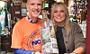 Anthony Morgan with Sabrina McTaggart with some of the money raised for Rathore School. Photograph: Columba O'Hare/ Newry.ie 
