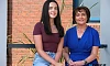  Chloe Coughlan is congratulated by Mrs McAlinden on achieving an exceptional 10 A* grades.