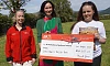 Katie Killen presents a cheque for £40,207.21 to Bébhionn Hardy and Kerry Anderson from Air Ambulance NI.