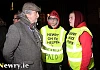 MLA Mickey Brady talks to Newry on Ice workers Eoghan Jones and Keith Dowd at the protest. Photograph: Columba O'Hare