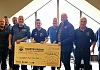 Rathfriland Motor Club members present a cheque for £693.60 to Slieve Croob First Responders.