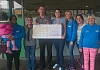 Barry presents the cheque