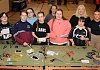 ey stage 4 girls from St Paul’s Bessbrook learn how to wire a plug with tutor Joanne Rea (centre back); Claire King from Women's Tec (second right); and Caitlin Magee from the Housing Executive (right) as part of a special construction day event at Women’s Tec, who are partnering with the Housing Executive to encourage local young people to consider careers in a range of trades.
