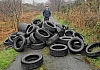 Cllr Terry Hearty with some of the dumped tyres at Cregganbaun.
