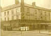 Quinn’s The Milestone c. 1920s showing staff, and sides of meat.  Newry and Mourne Museum