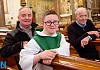 Sean McMillan with his dad John and Fr Vincent Travers, St Catherine's Dominican, Newry. Photograph: Columba O'Hare