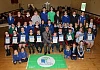 Cathy Gorman Eco Schools Officer, Keep Northern Ireland Beautiful and Cllr Mark Murnin, Chairperson Newry, Mourne and Down District Council with the Eco Councils from ten primary schools, including St Peter's PS Cloughreagh, St. Patrick's PS Hilltown, St. Mary's PS Mullaghbawn, Castlewellan PS who each received their 1st Green Flag, Windsor Hill PS Newry wo received their 2nd Flag, St Laurence O'Toole PS Belleeks who received their 3rd Flag, St. Bronagh's PS Rostrevor with their 3rd Flag, St. Malachy's PS Carnagat with their 4th Flag, Cumran PS Clough Downpatrick with their 8th Flag and Downpatrick Nursery School with their 10th Flag. 
