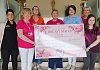 Representatives from Breast Mates Newry receive a cheque from St Mary's High School staff and pupil.