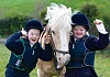 Dearbhail Savage and Maeve Robb from Saddle and Reins Special Olympic Equestrian Club, Newry with Bailey on Ice. The girls will represent Ulster in the All Ireland Special Olympics taking place in Limerick in June. Photograph: Columba O'Hare