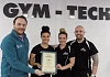 Cancer Focus NI Community Fundraiser Eoin Treanor is seen presenting Gym-Tech Newry trainers Laura Mc Keown, Carla King and Gary Mallon with a plaque as a thank you for their time and efforts during Focus Fit Newry which raised £7,200 for Cancer Focus NI.  