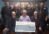 Members of Bessbrook District Vintage Tractor Club celebrate their fundraising for Southern Area Hospice which to date has raised over &pound;100K