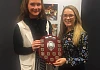 Jolene O'Hare, captain of the winning team is presented with their award.