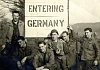 Third from right and holding a camera, James Quinn is seen here with his army comrades as they enter Germany in the late autumn of 1944.  Newry and Mourne Museum Collection