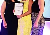 Emma Marmion and Lorraine Rooney from Prestige are presented with their award