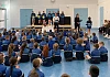 Infrastructure Minister Liz Kimmins MLA presents the Cycling Proficiency Certificates to pupils of Killean PS